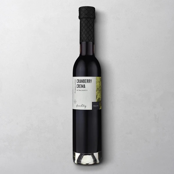 Wajos Cranberry Crema in 250ml Glasflasche mit schwarzem Verschluss und weißem Etikett