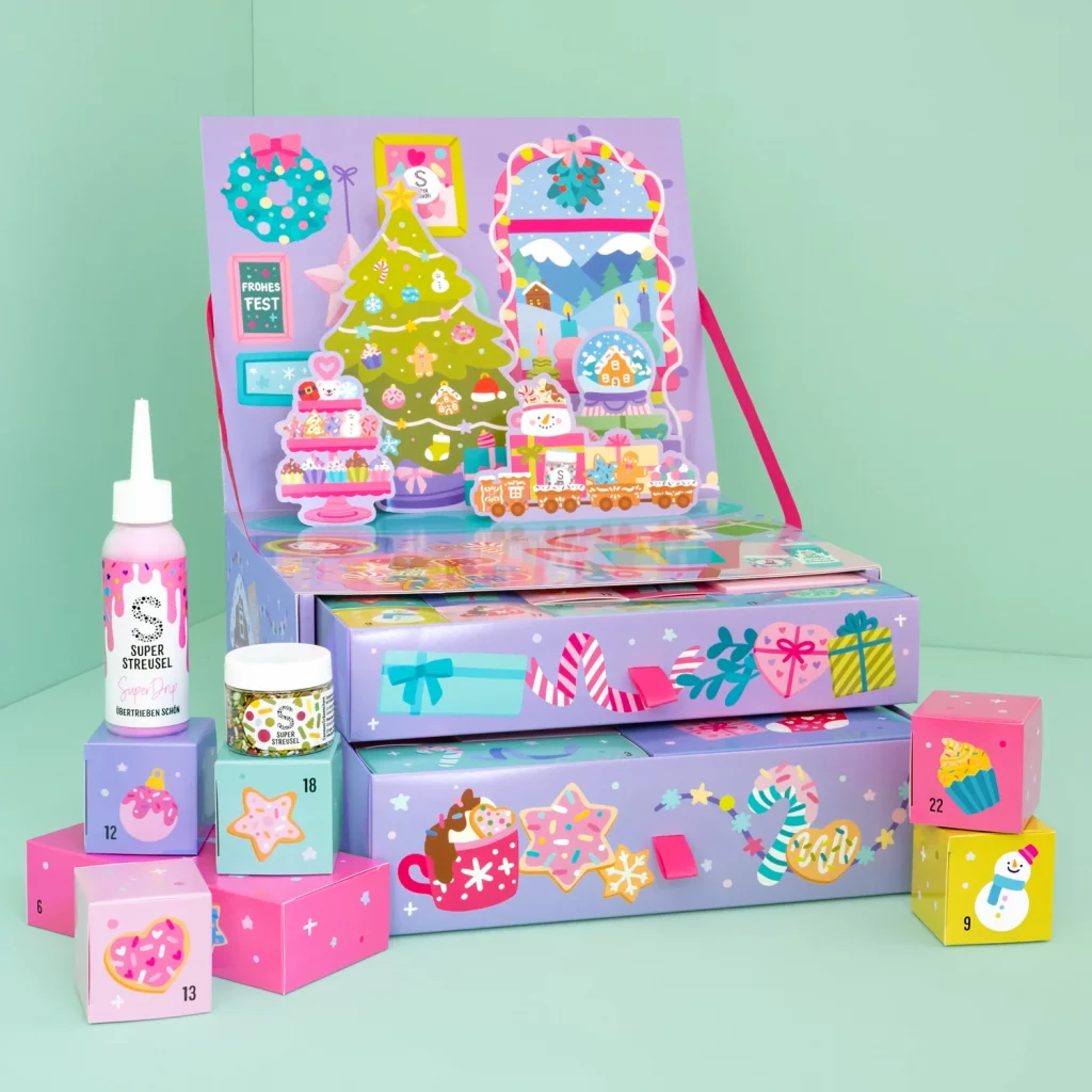Großer Super Streusel Adventskalender mit verschiedenen Drips und Streuseln abgebildet.
