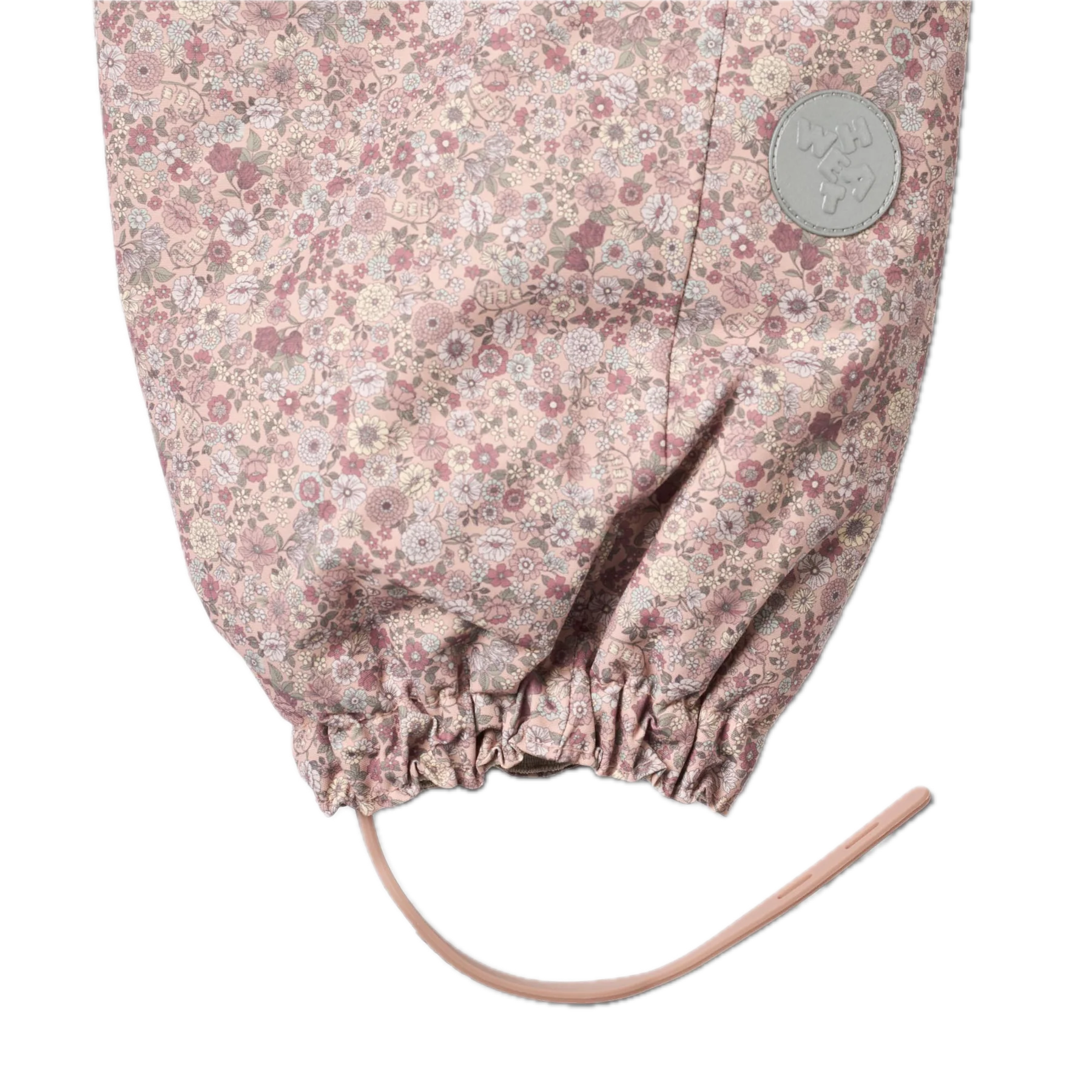 Wheat Skihose mit Trägern in Rosa mit Allover Blumenmuster Ton in Ton von Wheat (Detailansicht Fußschlaufe und Reflektor)